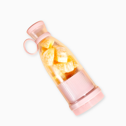 Pink water bottle with fruit infuser on a white background
