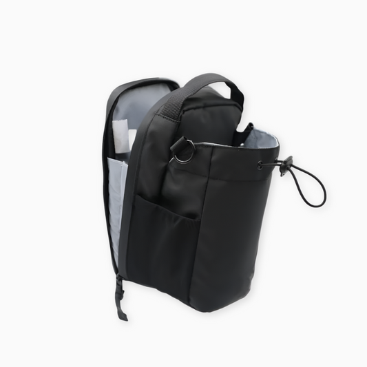 Black backpack with multiple pockets on a white background