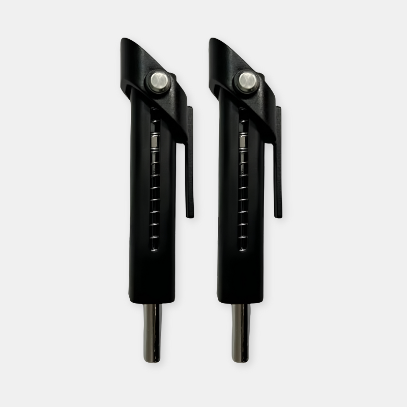 Two black archery nocks on a white background