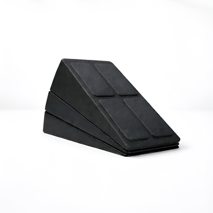 Black wedge-shaped foam roller on a white background