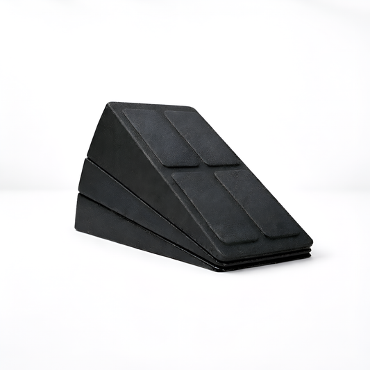 Black wedge-shaped foam roller on a white background