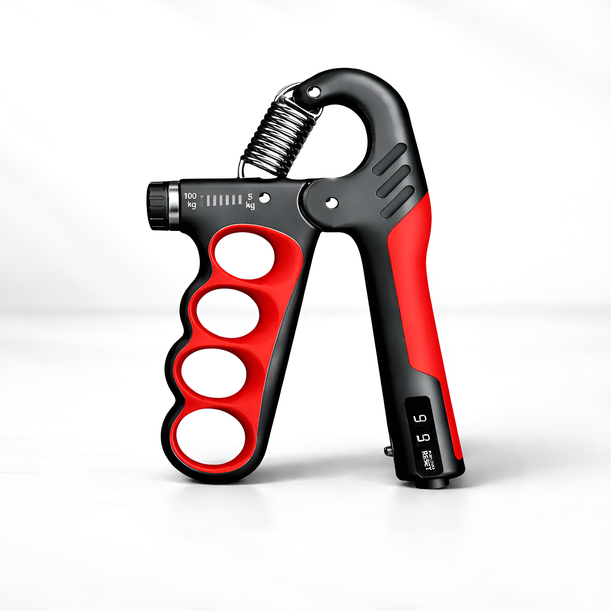 Red and black hand grip strengthener on a white background