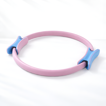 Pink and blue Pilates ring on a white background