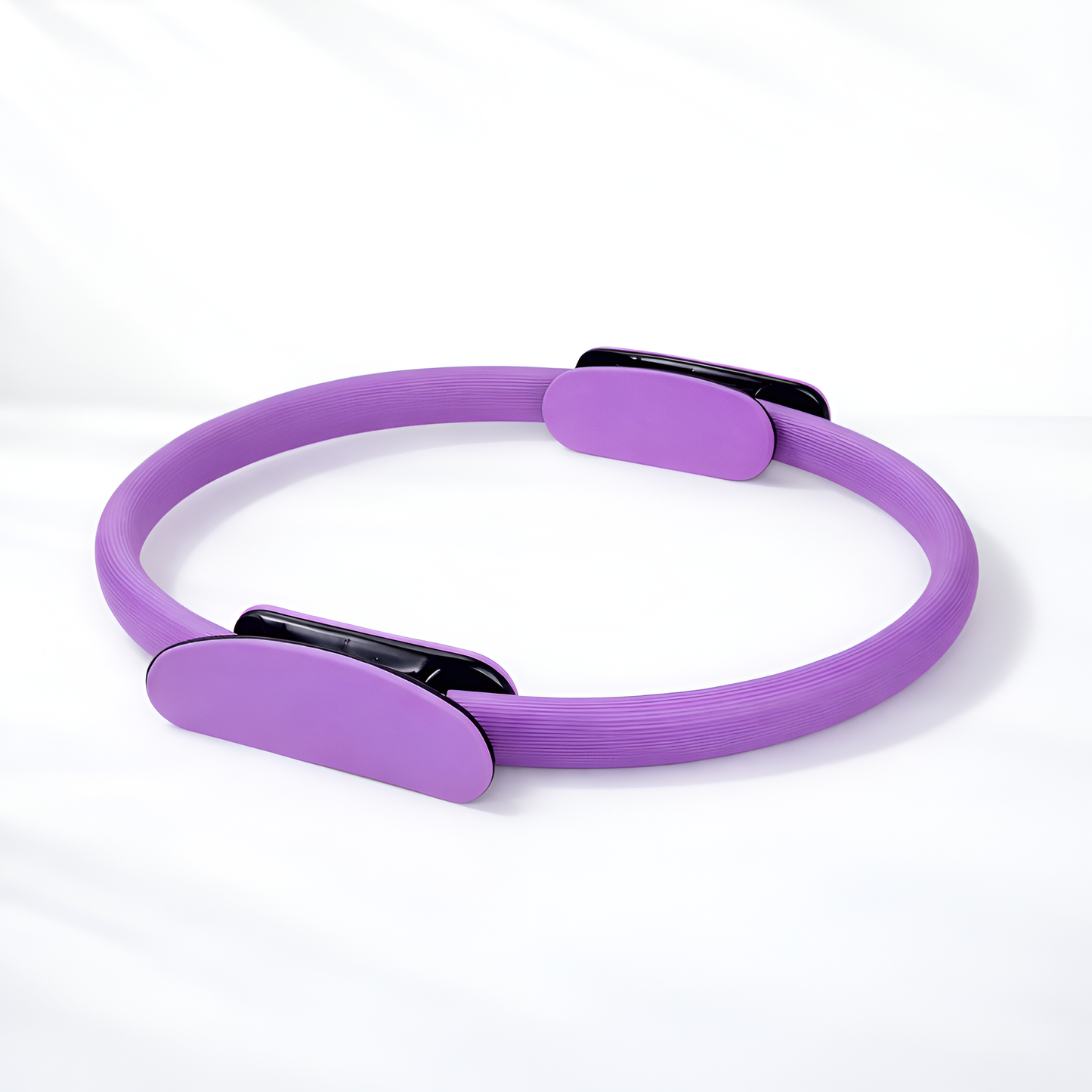Purple Pilates ring on a white background