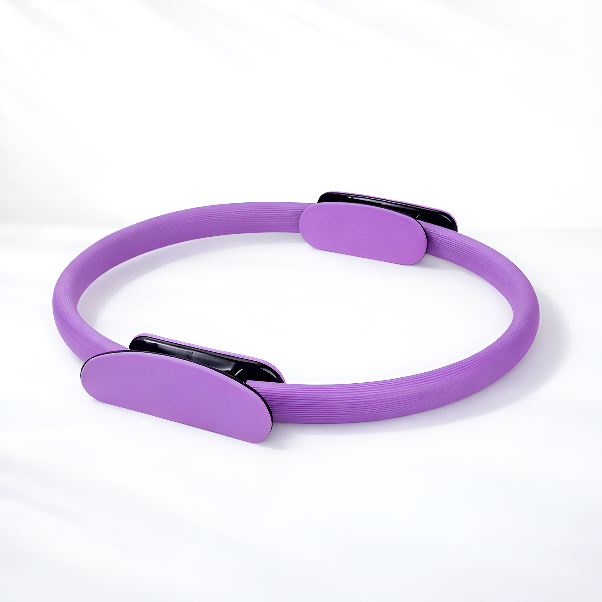 Purple Pilates ring on a white background