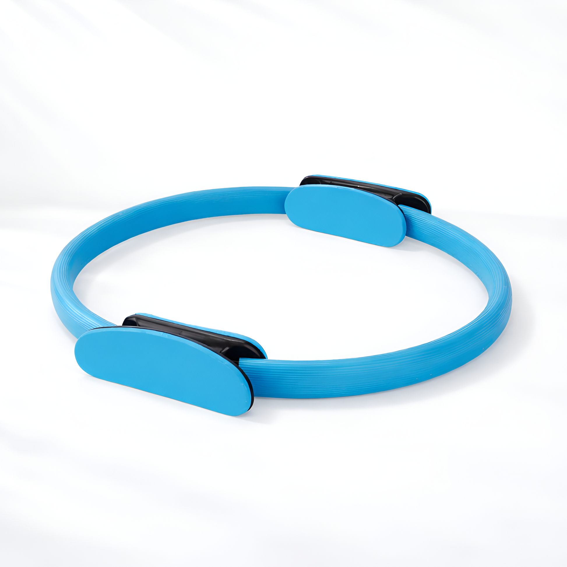 Blue Pilates ring with black accents on a white background