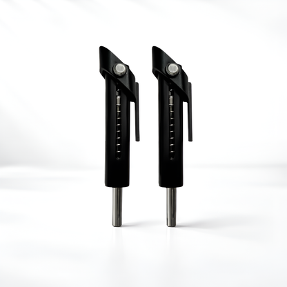 Two black metal tools with silver accents on a white background