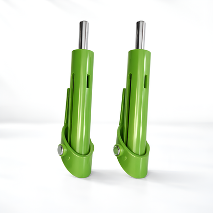 Two green metal tools with silver ends on a white background