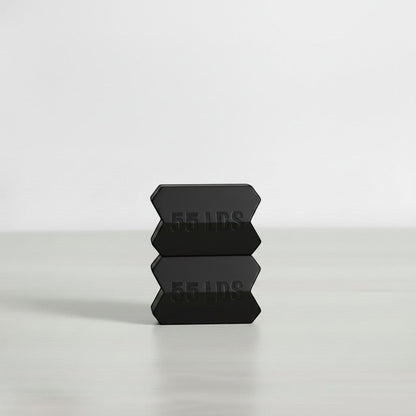 Dropset™ Official orange JawFlex 35 lbs weight plates stacked, designed for jawline exercise.