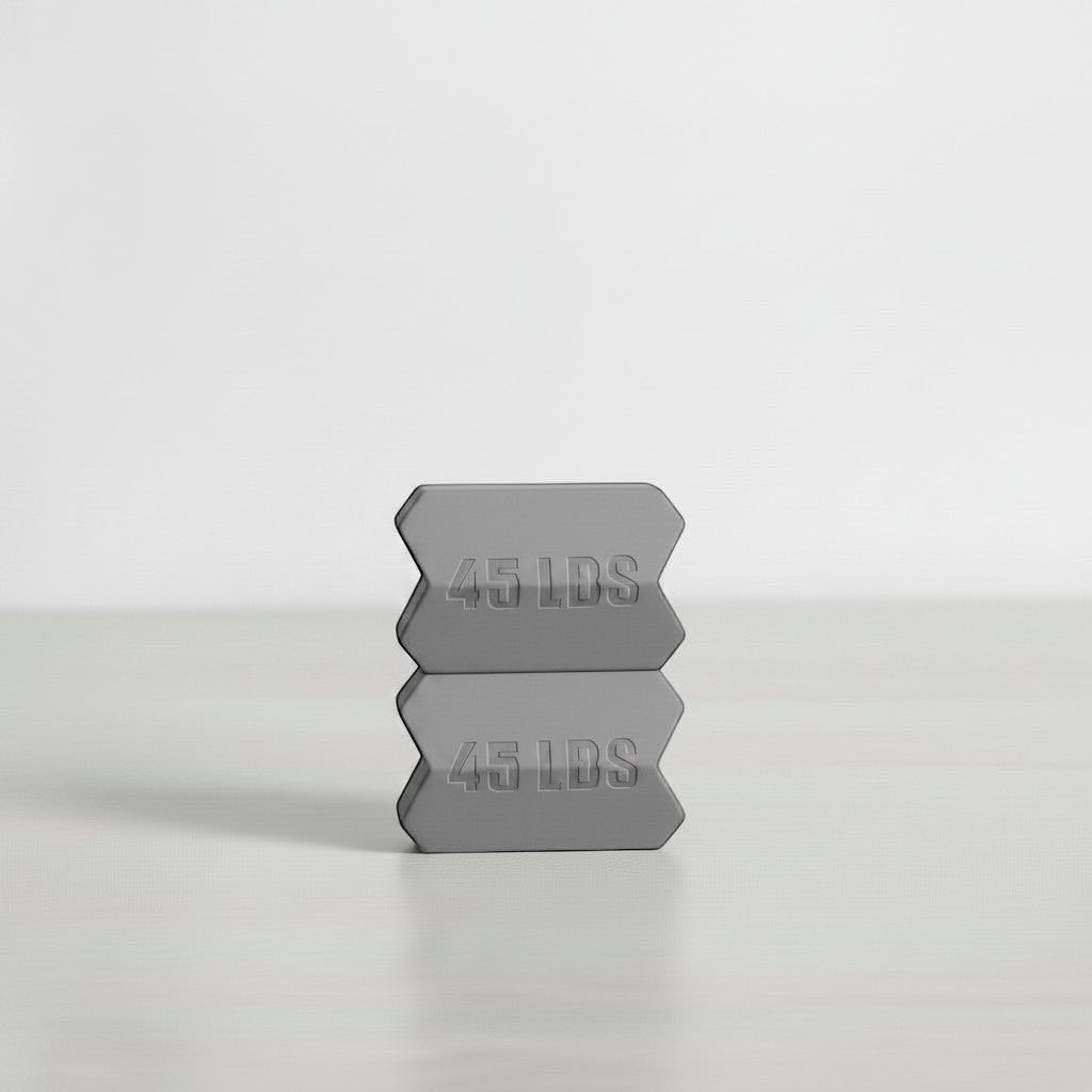 Dropset™ Official grey 45 lb weight plates stacked, designed for strength training.
